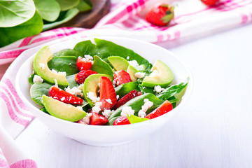 Summer salad with strawberry, avocado and spinach