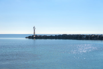 Fototapeta premium Small lighthouse in Cyclades, Greece during summer.