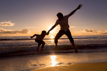 Father and son have great time on the beach