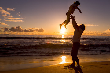 Father and son have great time on the beach