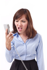 Fototapeta premium angry, upset businesswoman shouting, screaming on phone, studio