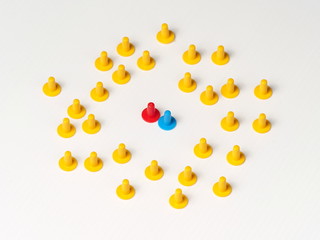 Random group with a pair standing out illustrated by coloured plastic board game hats in various colours, Melbourne 2016