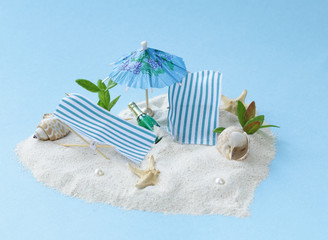 Travel vacation concept - sand island beach with sunbeds