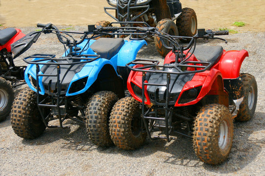 Red and blue ATV quad bike in Thailand