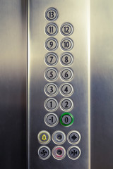 Different buttons in modern metal elevator    © zphoto83