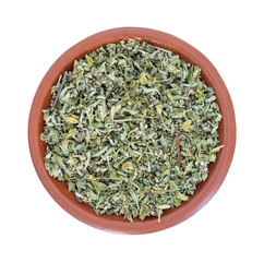 Damiana leaf in a small bowl isolated on a white background top view