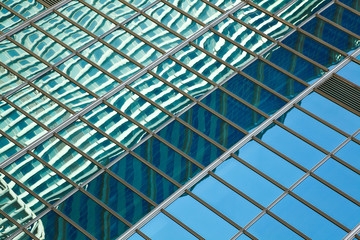 Obraz na płótnie Canvas Modern office architectur at blue glass wall backgrounds