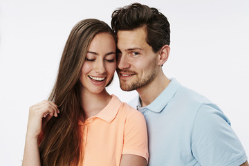 Smiling couple in white studio