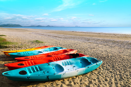 Colorful sport kayaks on the tropical beach, Pranburi, Thailand.
