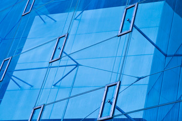 Fototapeta na wymiar Modern office architectur at blue glass wall backgrounds