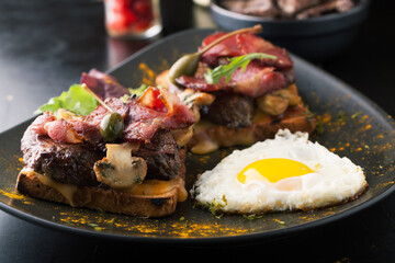 Toast with bacon and beef cutlet with cheese