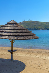 Sunshade umbrellas on the beach during a sunny summer day in Myk