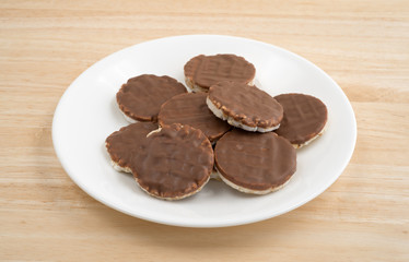 Organic rice cookies with milk chocolate icing on plate