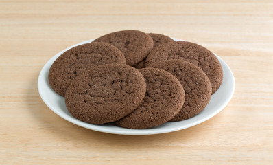 Plate of Dutch cocoa cookies on a wood table top