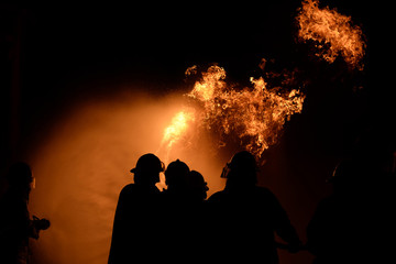 The firemen While practicing a fire at night.