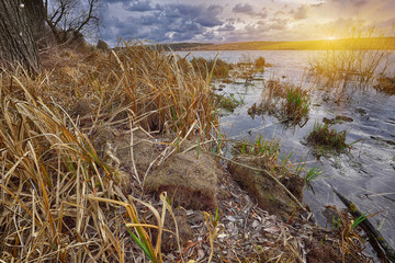 Cloudy weather over the lake at sunset