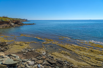 Rocky beach in Mykonos, Cyclades, Greece.