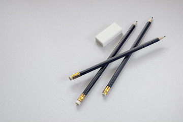 Blue  pencils and eraser on white background