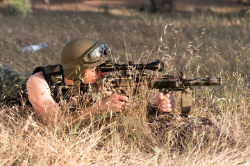 soldier in the uniform with weapon