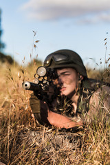 soldier in the uniform with weapon