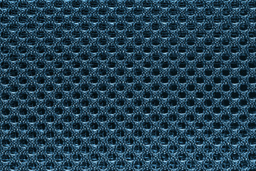 Blue fishnet cloth material as a texture background. Blue nylon texture for background with copy space for text or image.