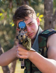 soldier in the uniform with weapon