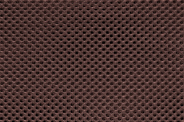 Brown fishnet cloth material as a texture background. Brown nylon texture for background with copy space for text or image.
