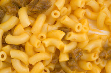 Close view of mac and cheese with hamburger chunks