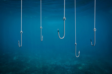 Multiple fishing hooks under sea water