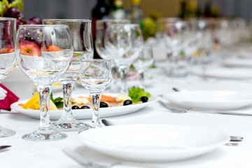 Banquet table decorated with glasses