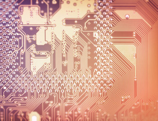 Circuit board close-up picture. Electronic background image with dimmed and blurred edges.