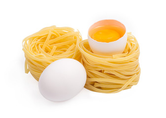 Eggs and paste tagliatelleon isolated on the white