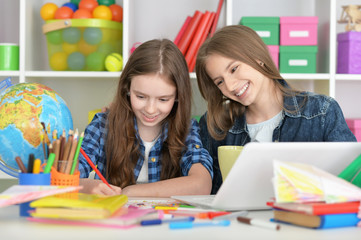 student girls at class with laptop 