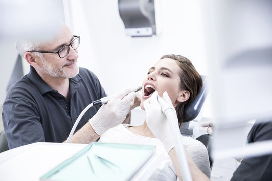 Young woman getting dental treatment