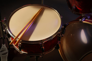Fototapeta na wymiar Drums set and sticks, close-up