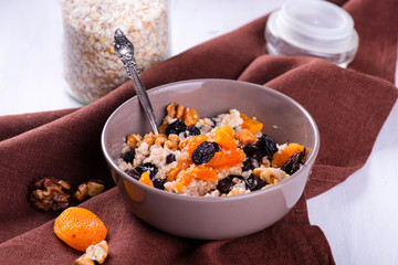 Oatmeal with raisins, dried apricots, plums