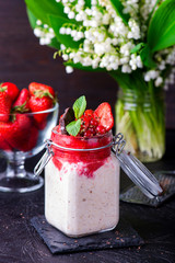 Healthy overnight oats with strawberry in jars