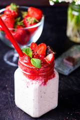 Healthy overnight oats with strawberry in jars