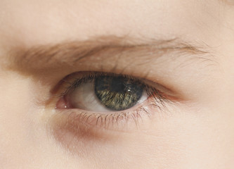 Obraz premium Closeup of the human eye. frowning girl