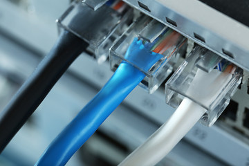 Ethernet cables connected to network switch, close up