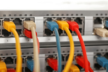 Ethernet cables connected to network switch, close up