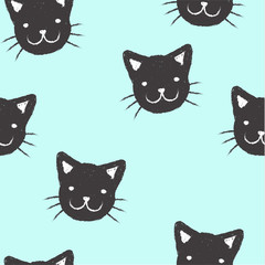 Seamless pattern with hand drawn black faced kitten on a blue background