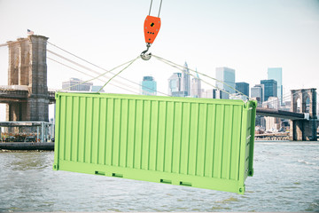 Green cargo container on hook