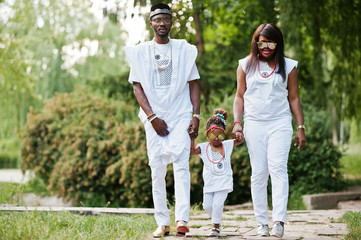 Naklejka na ściany i meble African american rich family at white nigerian national clothing