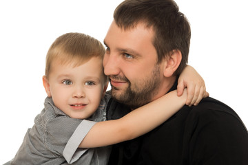 Happy son hugging his neck the arms of his beloved father. Close-up - Isolated on white background