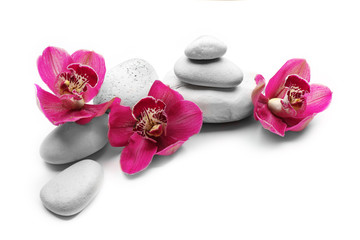 White spa stones and red orchid isolated on white