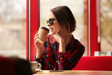 Young woman sitting in cafe