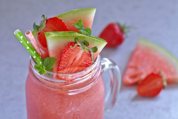 Watermelon and strawberry smoothie in a jar