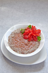 Chocolate oatmeal decorated with strawberry flower