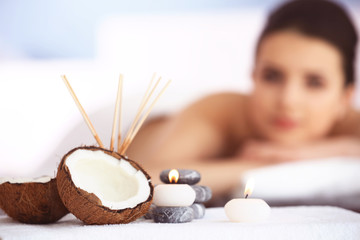 Obraz na płótnie Canvas Spa set with coconut and aroma sticks, close up